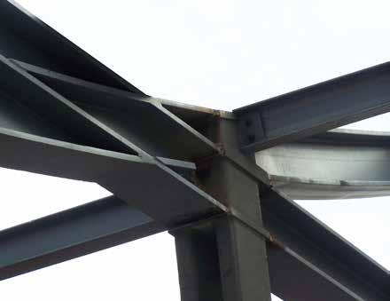 Spanning up to 60 ft between columns, the structural system supporting these ribbons is a tightly integrated plane of 12-in.