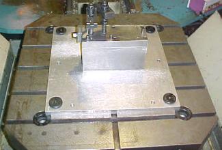 to the fixture plate using a variety of accessories, dowel pins, bolts, toe clamps, strap clamps, etc.