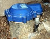 prevents contaminants from entering a well along the