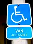 Scoping: Signs (ADAS 216.5) Says that the required accessible spaces are to be identified by the requirements in 502.
