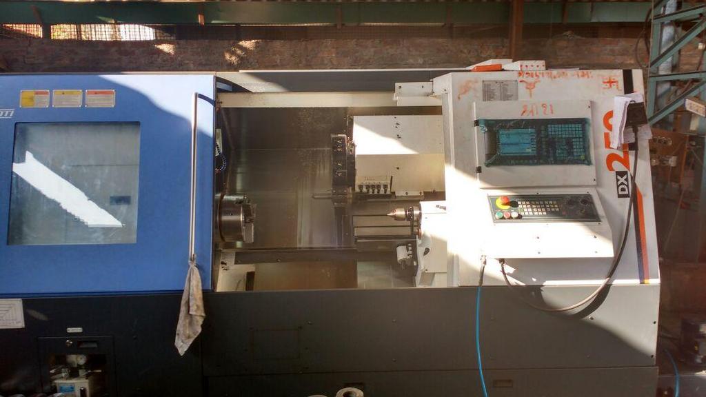 6. CNC Turning Center DX-250-1000 machine: Suitable for Turning, Boring and Threading of Job.