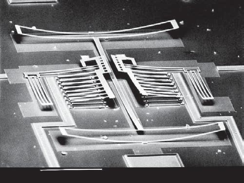 6 Introduction 200µM 20KV 00 017 S Figure 1.6 Deformation of a released structure due to stress-gradients at MCNC circa 1996.
