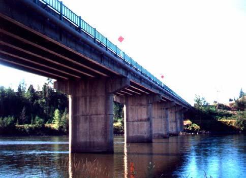 sheets. The final component of the externally bonded CFRP sheet system is a 2 to 4 mm thick protective coating. Fig. 4 (a): John Hart Bridge, Prince George BC Fig.