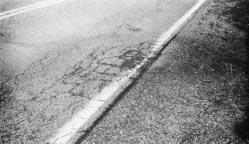 Pavement Failure Identification A-5 Edge Cracks with Surface Distortion and Pumping This distress is caused by wetting or drying action beneath the shoulder surface caused by conditions that trap