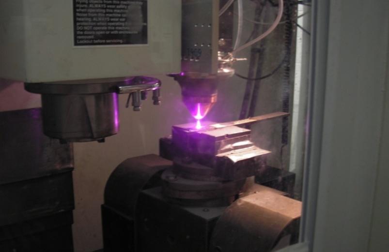 access for the laser beam and the feed material, with the laser striking the surface at roughly normal incidence [2]. The cladding process is faster than conventional chrome plating.