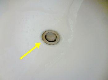 Toilets Tank base in the 1/2 bath is cracked/broken.