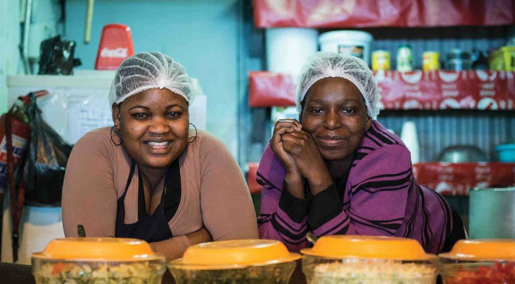 Featured Partner: KENYA WOMEN MICROFINANCE BANK Kenya Women Microfinance Bank clients selling food at their store.