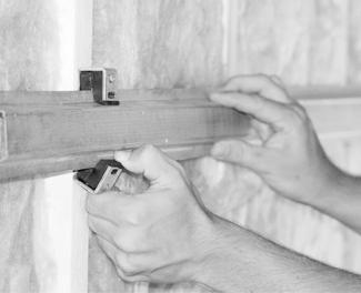 Install the drywall vertically from the bottom up leaving a 1/4 thick gap around perimeter of wall to be filled with acoustical caulk. Caulk around the entire perimeter of the gypsum board.