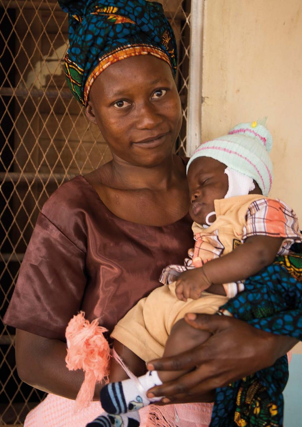 32-year-old Flora holds her young son, Melckezedek, as she attends the post-natal health clinic