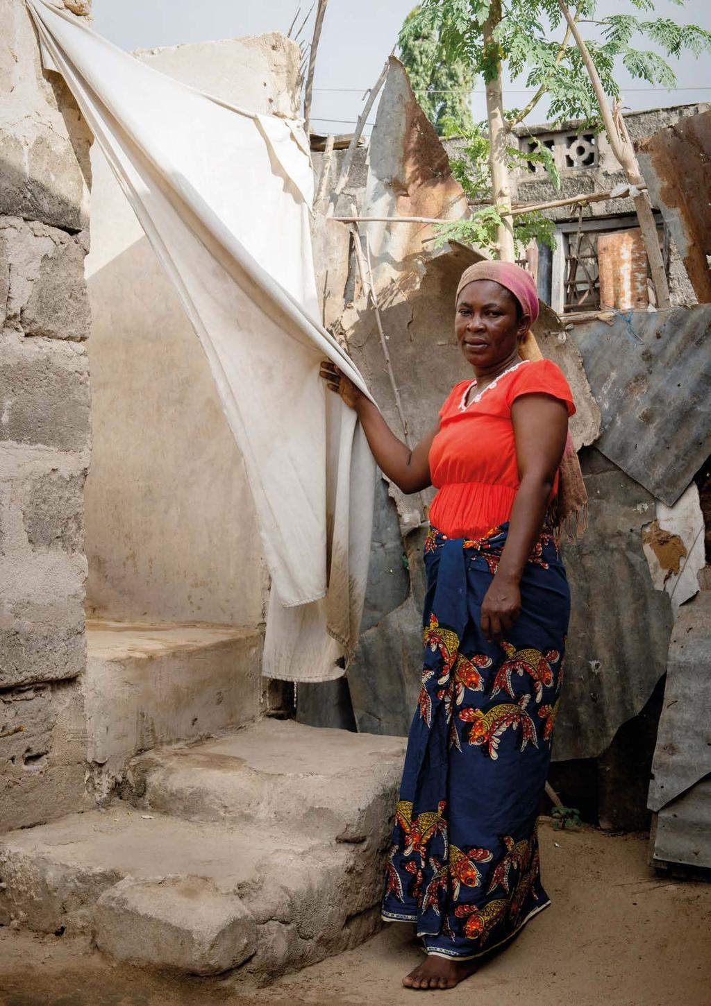 Fatouma Hamisi, 40, outside her pit latrine at her house in Mbagala,