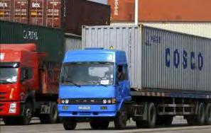 Trucks pick up containers and transport them from the terminal to the