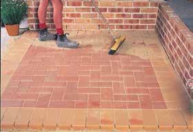 Using your screed, level an area between the two pavers so that you can lay your screeding rails on the level surface. 5.