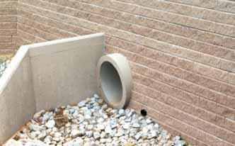 Divert sources of concentrated water flow from the wall. Retaining wall designs must prevent the pooling of water above or below the wall.