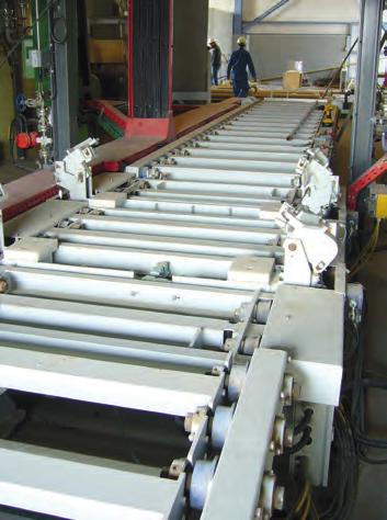 At the end of the roller conveyor system the filled forms are picked up by a fork lift and transported to the hardening area. For the production of molds batch mixers are used.