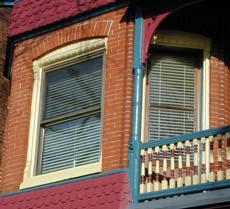 To accommodate a standard storm window, the opening was boxed in, detracting from the appearance of the window.