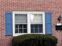If the shutters were closed, they would fit the window opening exactly.