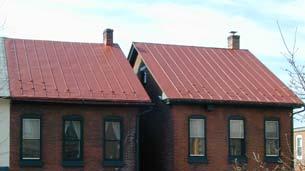Light colored asphalt shingles are not compatible with historic buildings.