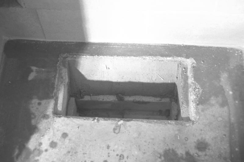 The 2 steel flat bars are mortared, and there is a full mortar bed between the flat bars and the firebox floor.