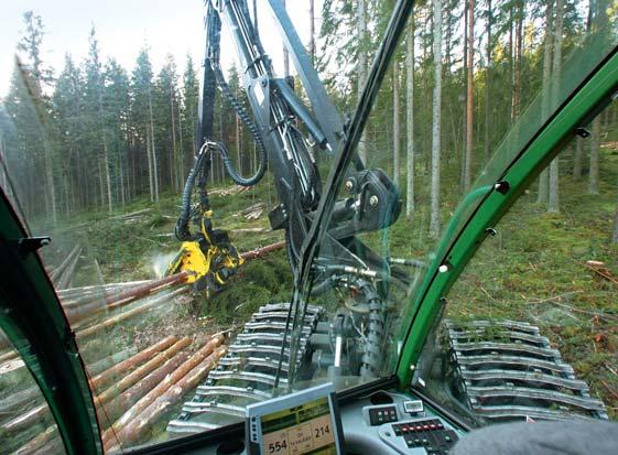 HARVESTERS GOOD VISIBILITY. EVERYTHING TO HAND. The cab of the John Deere harvesters is a good place for doing productive work.