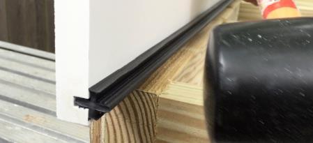 Keep the frieze board perfectly straight against the house, shimming where needed.