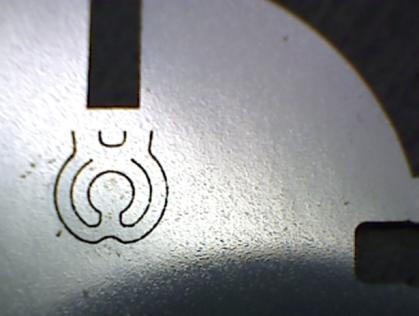 An optimized etching process will provide a line thickness closer to the desired value. In order to obtain this lower line thickness value, the mask line thickness should be reduced to 50 µm.