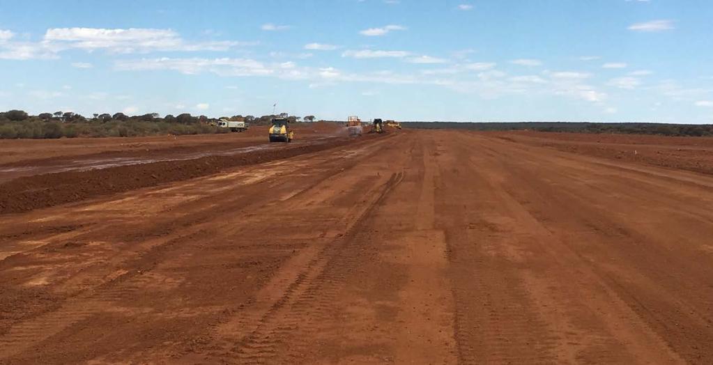 The runway construction is well advanced and on schedule to allow direct flights to site from March 2018 (see Photo 14).