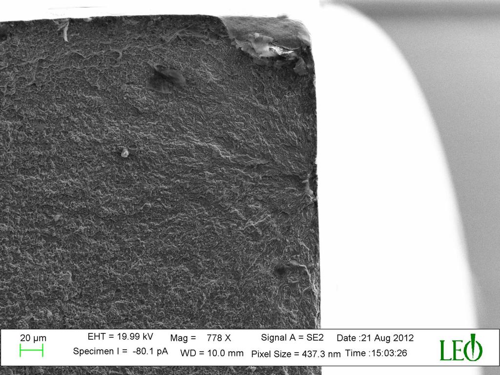 Figure 18 SEM Images showing crack initiation at brittle oxide inclusion. The circled region in the above image is the initiation point of fatigue fracture.