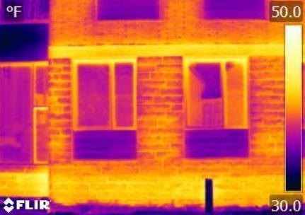 Figure 5. (Left) IR image of a window frame under zero pressure. (Right) Air leakage around an operable window vent under positive pressure (white arrow).