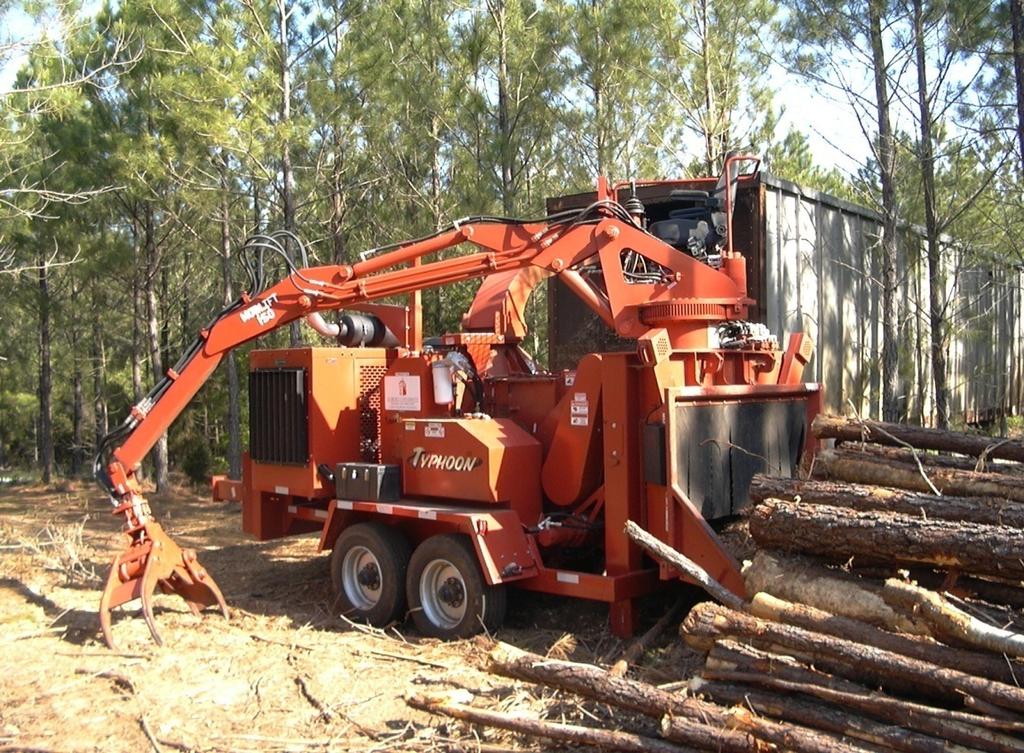 Figure 2. Turbo Forest skidder with a grapple attachment. Figure 3. Morbark Typhoon chipper with a loader attachment.