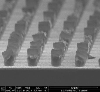 image of single bumps with Cu/Ni/Sn and some underetch of Cu but no delamination of bumps Later the 10µm pitch bumping process was modified.