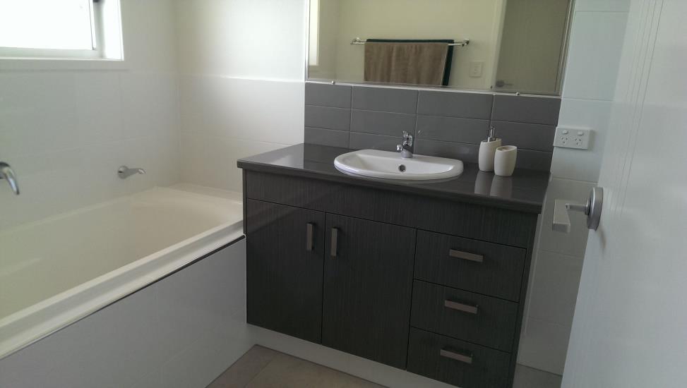 Bathroom, ensuite, WC & Powder Room (if applicable) Tiling Colours from Builders selection Vanity Cabinets Laminate door fronts and bench tops, colour from Builders selection Vanity Basins Vitreous