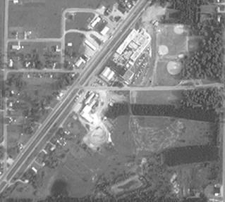 1992 Aerial Photograph MONITORING WELLS INSTALLED BY THE EPA IN 1986 FORMER TREATED WASTE SETTLING LAGOONS AND INDUSTRIAL WASTE