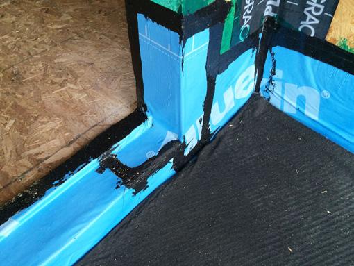 This additional metal flashing protects the membrane waterproofing at the door opening.