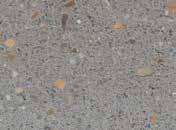 The honed process grinds 2-3mm from the block surface, producing a matt exposed-aggregate finish.