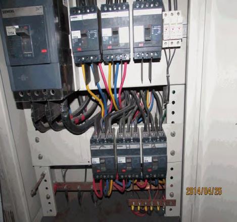 Finding #: E- 9 SWITCH BOARD & PANELS Panel base plates removed to allow cable entry.
