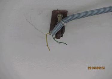 Cable from generator output terminal to LT panel drawn in flexible conduit, laid on floor. Finding #: E- 13 CABLE & CABLE SUPPORTS Disconnected cables from equipment are left naked.