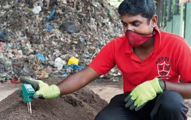 Testing compost made from treated waste in Kurunegala. Hamish John Appleby/IWMI.