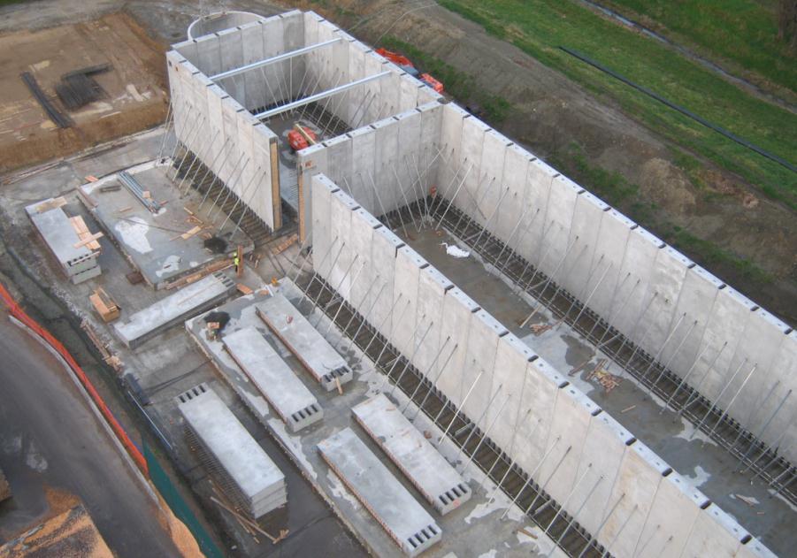 below). Figure 6. Precast Walls Tilted Up and Foundation Reinforcement in Place 4.