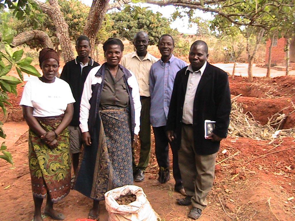Figure 6 : Lady farmer in the centre who was instrumental in making Bokashi pellets together with co-workers and regional Farm Officer (in black jacket) 3.