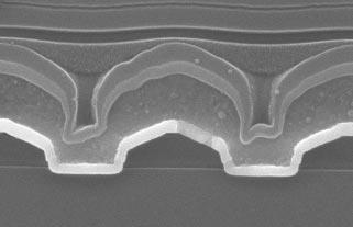 SEM section views illustrating typical metal 1 contacts.