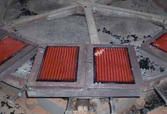The basalt is melted in shaft furnaces at 1,300 C and then poured into the desired forms.