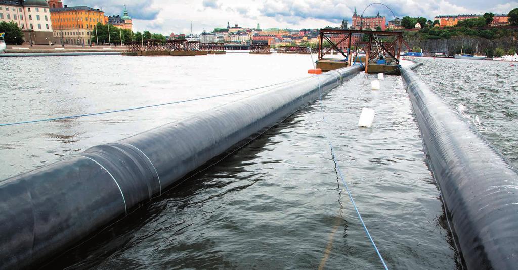 Coated water mains are floated in front of the Royal Palace in Stockholm just before their final submersion. 3.