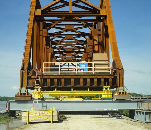 HORZONTAL SLIDING OF TRUSSES The approach span trusses required horizontal sliding for two reasons: (1) after the trusses had been erected at Green Bay they had to be moved from the erection work