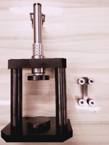 uniform rates of straining or loading. The test specimens employed are characterized of a standard shape. This fixture is used in order to test composite materials in uniaxial compression.