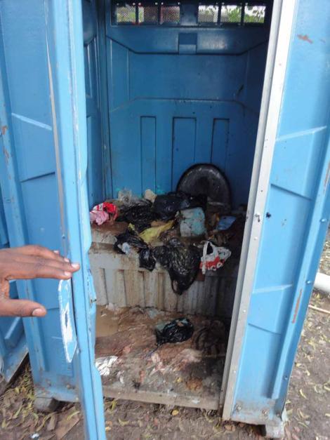 Overflowing porta-potty Haiti Broken water