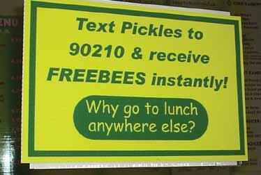 The signs read: Text Pickles to 90210 & receive FREEBIES instantly! Why go to lunch anywhere else?