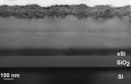 4 µm below the strained silicon surface, i.e. close to the interface between the underlying Si 0.77 Ge 0.23 layer and the Si substrate.