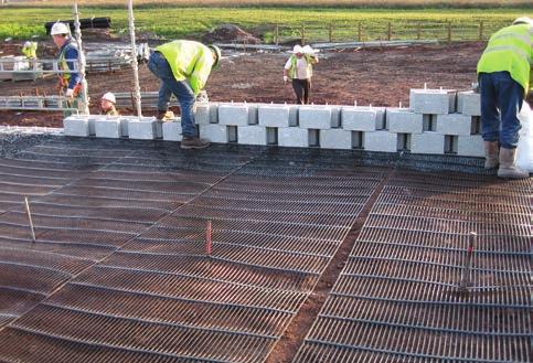 The TensarTech TW3 Wall System consists of pre-cast concrete modular facing blocks in combination with Tensar geogrids which reinforce the soil mass behind.
