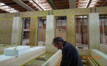 Wood curtain walls are prefabricated horizontally and