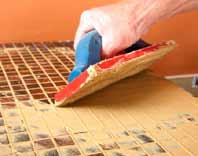 ING Grout can be applied to a clean, dry surface. (See Step 8 Expansion Joints ) Before applying grout be sure that the mosaic surface is clean and all clear tape is removed from the tiles.